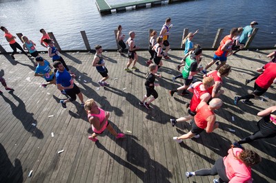 061019 - Cardiff Half Marathon 2019 - Runners make their way through Cardiff Bay, Roald Dahl Plas and past the Wales Millennium Centre at the halfway point of the race