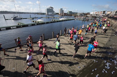 061019 - Cardiff Half Marathon 2019 - Runners make their way through Cardiff Bay, Roald Dahl Plas and past the Wales Millennium Centre at the halfway point of the race