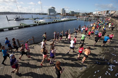 061019 - Cardiff Half Marathon 2019 - Runners make their way through Cardiff Bay, Roald Dahl Plas and past the Wales Millennium Centre at the halfway point of the race