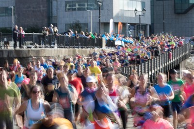 061019 - Cardiff Half Marathon 2019 - Runners make their way through Cardiff Bay, Roald Dahl Plas and past the Wales Millennium Centre at the halfway point of the race