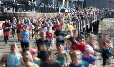 061019 - Cardiff Half Marathon 2019 - Runners make their way through Cardiff Bay, Roald Dahl Plas and past the Wales Millennium Centre at the halfway point of the race