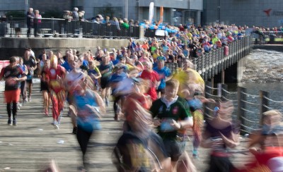 061019 - Cardiff Half Marathon 2019 - Runners make their way through Cardiff Bay, Roald Dahl Plas and past the Wales Millennium Centre at the halfway point of the race