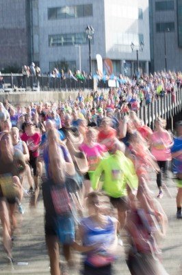 061019 - Cardiff Half Marathon 2019 - Runners make their way through Cardiff Bay, Roald Dahl Plas and past the Wales Millennium Centre at the halfway point of the race