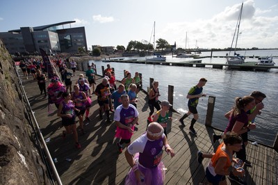 061019 - Cardiff Half Marathon 2019 - Runners make their way through Cardiff Bay, Roald Dahl Plas and past the Wales Millennium Centre at the halfway point of the race