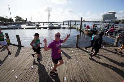 061019 - Cardiff Half Marathon 2019 - Runners make their way through Cardiff Bay, Roald Dahl Plas and past the Wales Millennium Centre at the halfway point of the race