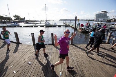 061019 - Cardiff Half Marathon 2019 - Runners make their way through Cardiff Bay, Roald Dahl Plas and past the Wales Millennium Centre at the halfway point of the race