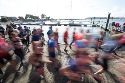 061019 - Cardiff Half Marathon 2019 - Runners make their way through Cardiff Bay, Roald Dahl Plas and past the Wales Millennium Centre at the halfway point of the race