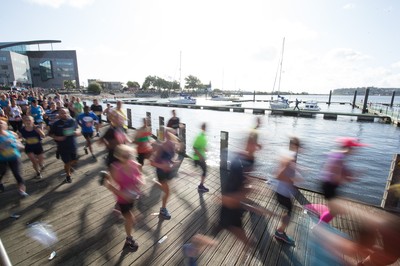 061019 - Cardiff Half Marathon 2019 - Runners make their way through Cardiff Bay, Roald Dahl Plas and past the Wales Millennium Centre at the halfway point of the race