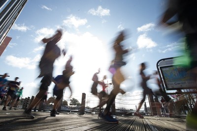 061019 - Cardiff Half Marathon 2019 - Runners make their way through Cardiff Bay, Roald Dahl Plas and past the Wales Millennium Centre at the halfway point of the race