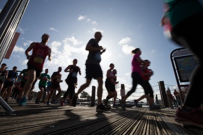 061019 - Cardiff Half Marathon 2019 - Runners make their way through Cardiff Bay, Roald Dahl Plas and past the Wales Millennium Centre at the halfway point of the race