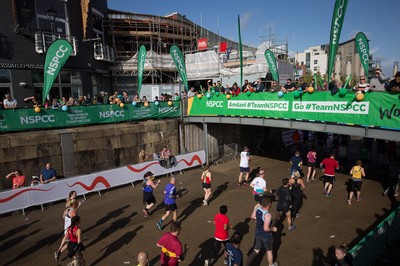 061019 - Cardiff Half Marathon 2019 - Runners make their way through Cardiff Bay, Roald Dahl Plas and past the Wales Millennium Centre at the halfway point of the race