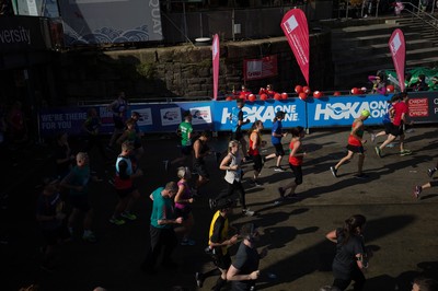 061019 - Cardiff Half Marathon 2019 - Runners make their way through Cardiff Bay, Roald Dahl Plas and past the Wales Millennium Centre at the halfway point of the race