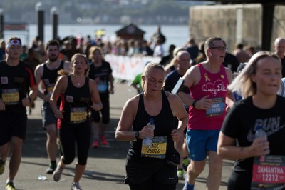 061019 - Cardiff Half Marathon 2019 - Runners make their way through Cardiff Bay, Roald Dahl Plas and past the Wales Millennium Centre at the halfway point of the race