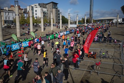 061019 - Cardiff Half Marathon 2019 - Runners make their way through Cardiff Bay, Roald Dahl Plas and past the Wales Millennium Centre at the halfway point of the race