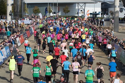 061019 - Cardiff Half Marathon 2019 - Runners make their way through Cardiff Bay, Roald Dahl Plas and past the Wales Millennium Centre at the halfway point of the race