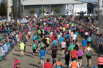 061019 - Cardiff Half Marathon 2019 - Runners make their way through Cardiff Bay, Roald Dahl Plas and past the Wales Millennium Centre at the halfway point of the race