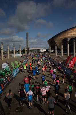 061019 - Cardiff Half Marathon 2019 - Runners make their way through Cardiff Bay, Roald Dahl Plas and past the Wales Millennium Centre at the halfway point of the race