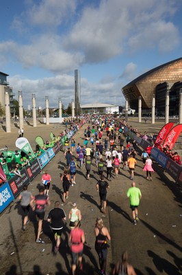 061019 - Cardiff Half Marathon 2019 - Runners make their way through Cardiff Bay, Roald Dahl Plas and past the Wales Millennium Centre at the halfway point of the race