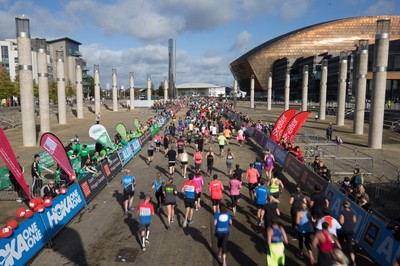 061019 - Cardiff Half Marathon 2019 - Runners make their way through Cardiff Bay, Roald Dahl Plas and past the Wales Millennium Centre at the halfway point of the race