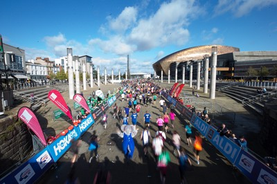 061019 - Cardiff Half Marathon 2019 - Runners make their way through Cardiff Bay, Roald Dahl Plas and past the Wales Millennium Centre at the halfway point of the race