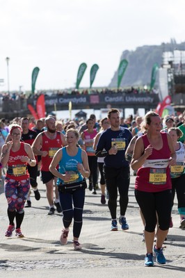 061019 - Cardiff Half Marathon 2019 - Runners make their way through Cardiff Bay, Roald Dahl Plas and past the Wales Millennium Centre at the halfway point of the race