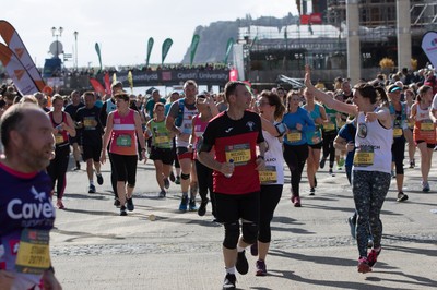 061019 - Cardiff Half Marathon 2019 - Runners make their way through Cardiff Bay, Roald Dahl Plas and past the Wales Millennium Centre at the halfway point of the race