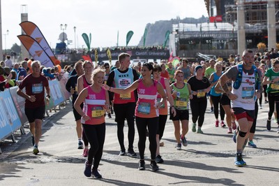 061019 - Cardiff Half Marathon 2019 - Runners make their way through Cardiff Bay, Roald Dahl Plas and past the Wales Millennium Centre at the halfway point of the race