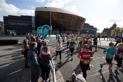 061019 - Cardiff Half Marathon 2019 - Runners make their way through Cardiff Bay, Roald Dahl Plas and past the Wales Millennium Centre at the halfway point of the race