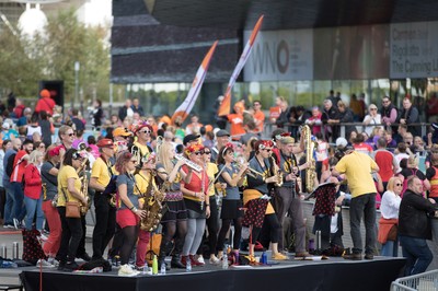 061019 - Cardiff Half Marathon 2019 - Runners make their way through Cardiff Bay, Roald Dahl Plas and past the Wales Millennium Centre at the halfway point of the race