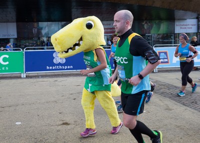 061019 - Cardiff Half Marathon 2019 - Runners make their way through Cardiff Bay, Roald Dahl Plas and past the Wales Millennium Centre at the halfway point of the race