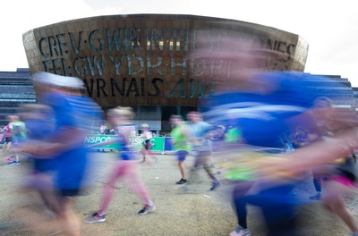 061019 - Cardiff Half Marathon 2019 - Runners make their way through Cardiff Bay, Roald Dahl Plas and past the Wales Millennium Centre at the halfway point of the race