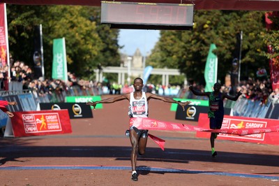 061019 - Cardiff Half Marathon -   Men's winner Leonard Langat crosses the line ahead of second placed Shadrack Kimining