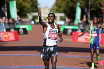 061019 - Cardiff Half Marathon -   Men's winner Leonard Langat crosses the line ahead of second placed Shadrack Kimining