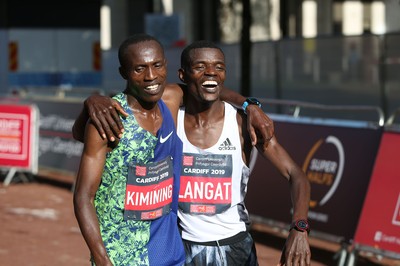 061019 - Cardiff Half Marathon -   Men's winner Leonard Langat crosses the line ahead of second placed Shadrack Kimining