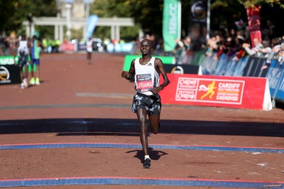 061019 - Cardiff Half Marathon -   John Lotiang crosses the line in third place 