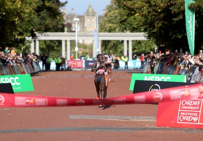 061019 - Cardiff Half Marathon -   Women's winner Lucy Cheruiyot crosses the line ahead of second placed Azmera Abreha