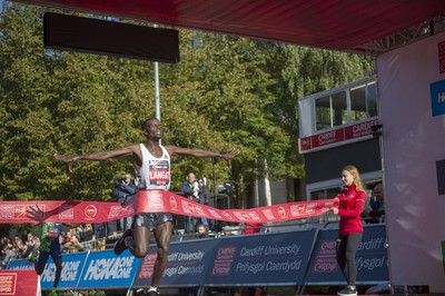 061019 - Cardiff Half Marathon -   Men's winner Leonard Langat crosses the line ahead of second placed Shadrack Kimining