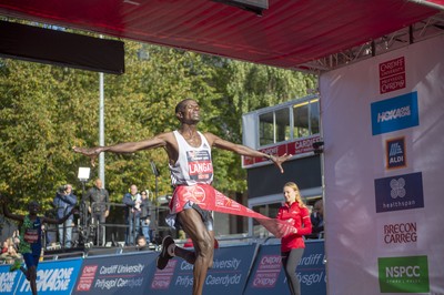 061019 - Cardiff Half Marathon -   Men's winner Leonard Langat crosses the line ahead of second placed Shadrack Kimining