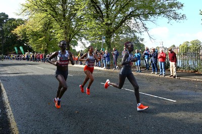 061019 - Cardiff University Cardiff Half Marathon - Runners pass Roath Park Lake