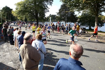 061019 - Cardiff University Cardiff Half Marathon - Runners pass Roath Park Lake