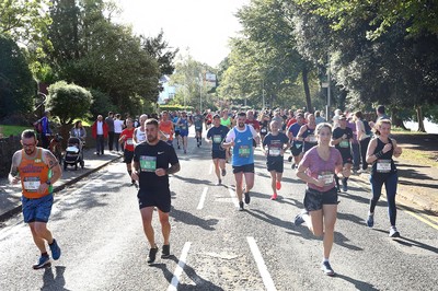 061019 - Cardiff University Cardiff Half Marathon - Runners pass Roath Park Lake