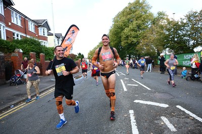 061019 - Cardiff University Cardiff Half Marathon - Runners pass Roath Park Lake