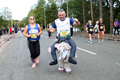 061019 - Cardiff University Cardiff Half Marathon - Runners pass Roath Park Lake