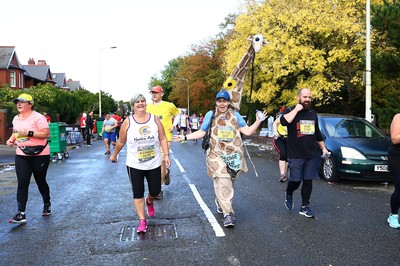 061019 - Cardiff University Cardiff Half Marathon - Runners pass Roath Park Lake