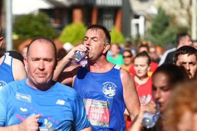 061019 - Cardiff University Cardiff Half Marathon - Runners rehydrate with Brecon Carreg water and Lucozade at Roath Park Lake