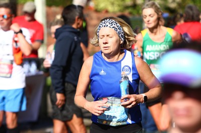 061019 - Cardiff University Cardiff Half Marathon - Runners rehydrate with Brecon Carreg water and Lucozade at Roath Park Lake