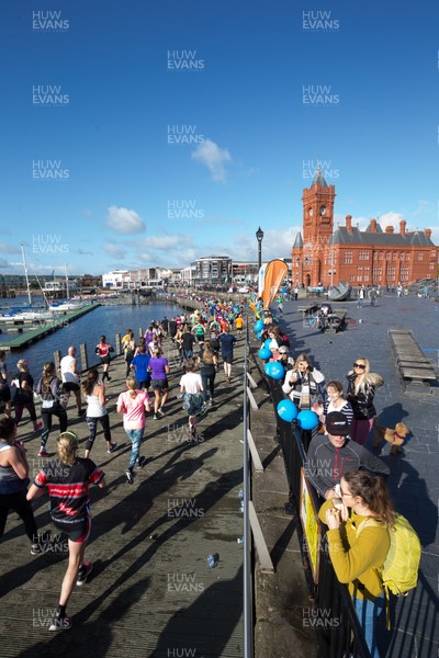 061019 - Cardiff Half Marathon 2019 - Runners make their way through Cardiff Bay, Roald Dahl Plas and past the Wales Millennium Centre at the halfway point of the race