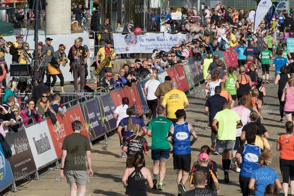 061019 - Cardiff Half Marathon 2019 - Runners make their way through Cardiff Bay, Roald Dahl Plas and past the Wales Millennium Centre at the halfway point of the race