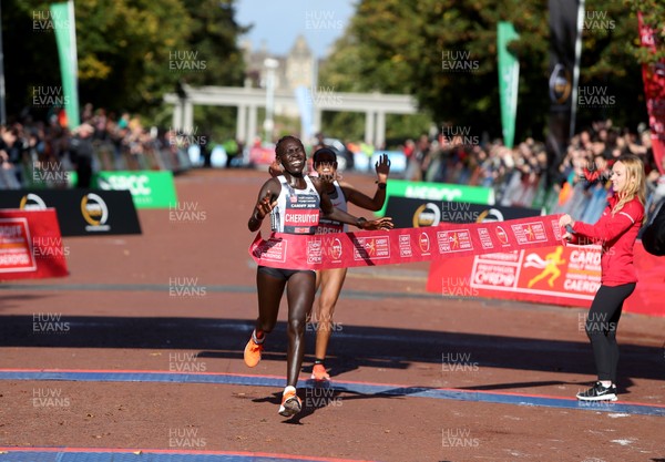 061019 - Cardiff Half Marathon -   Women's winner Lucy Cheruiyot crosses the line ahead of second placed Azmera Abreha