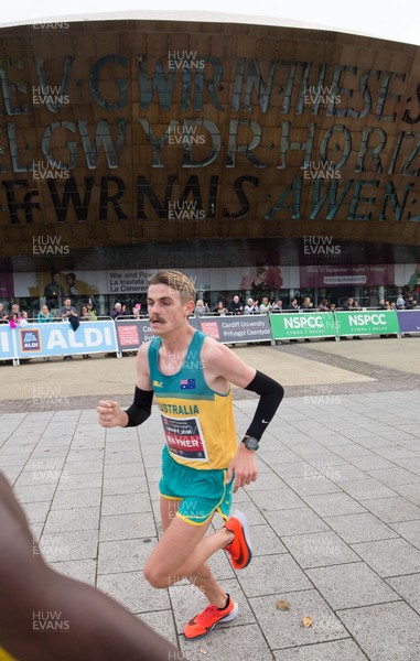 071018 - Cardiff University Cardiff Half Marathon - Race winner Jack Rayner makes his way through Roald Dahl Plas and past the Wales Millennium Centre